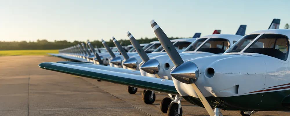 Training aircraft lined up on an airport apron