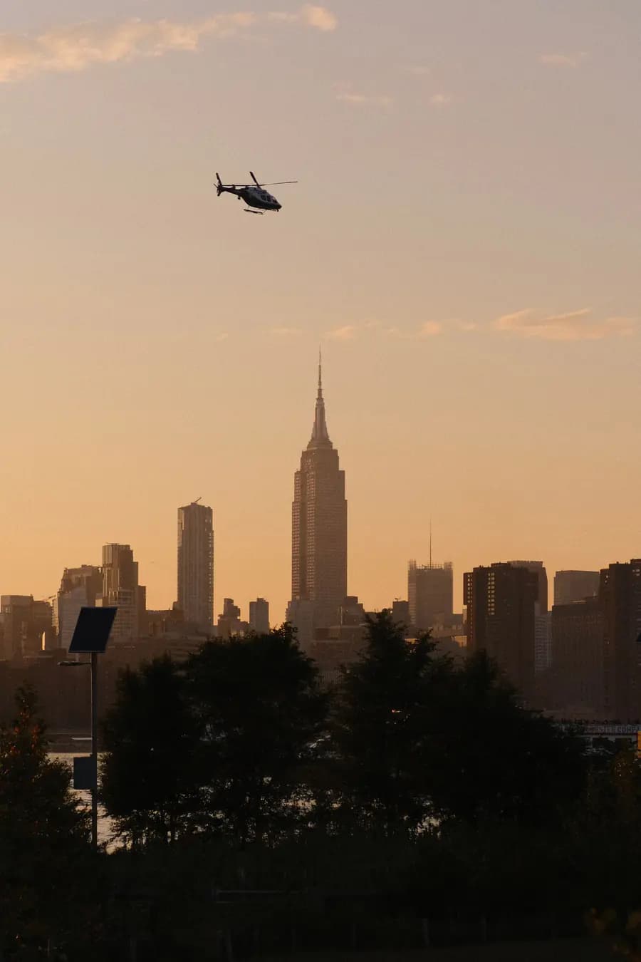 Helicopter operating above a dense city skyline
